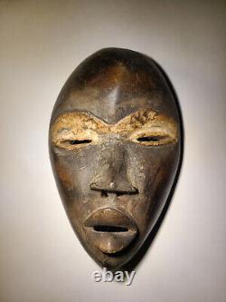 Two vintage African Masks Female and Male, Sculpted, Ivory Coast