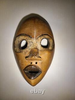 Deux masques africains vintage féminin et masculin, sculptés, Côte d'Ivoire