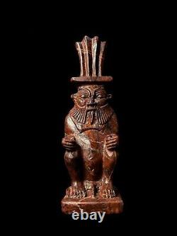 L'art égyptien / la sculpture de la statue de Bes, dieu de la protection, du sexe et de la joie