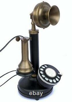 Réplique d'un téléphone de bureau à cadran rotatif de style antique, vintage et fonctionnel.